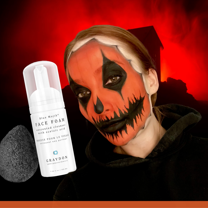 Close up of woman's face with heavy halloween makeup.